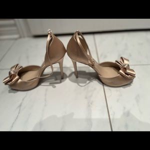 Beige high heels that have only been worn once.